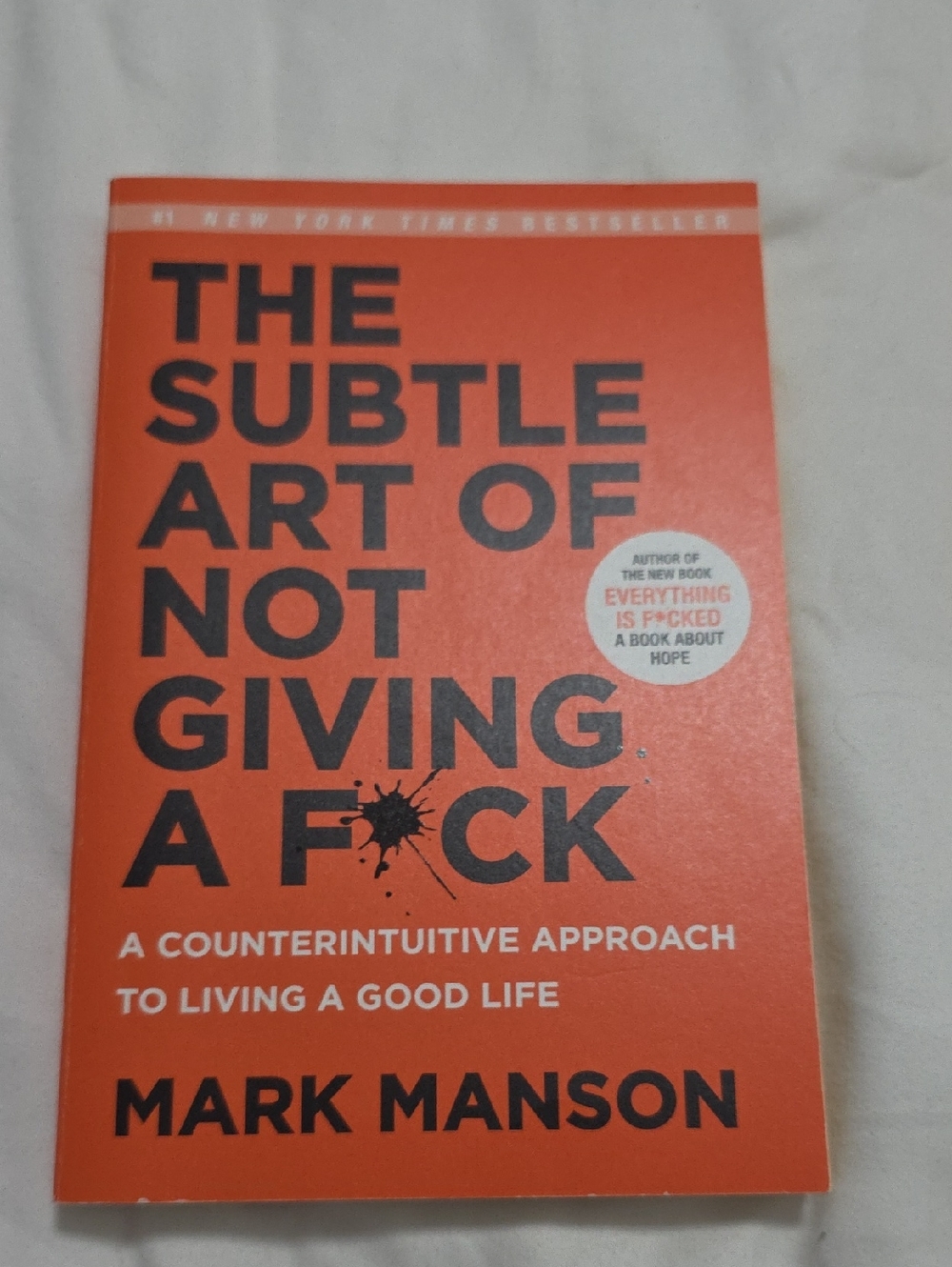 The Subtle Art of Not Giving a F*ck by Mark Manson - Orange Cover